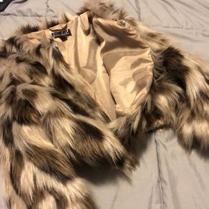 Sexy, mid waist, mid arm Uneck fur coat.